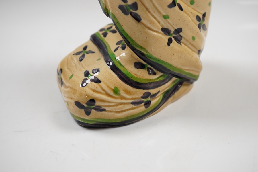 An Ashtead pottery figure of a kneeling ‘eastern lady’, stamped to the base, 15cm high